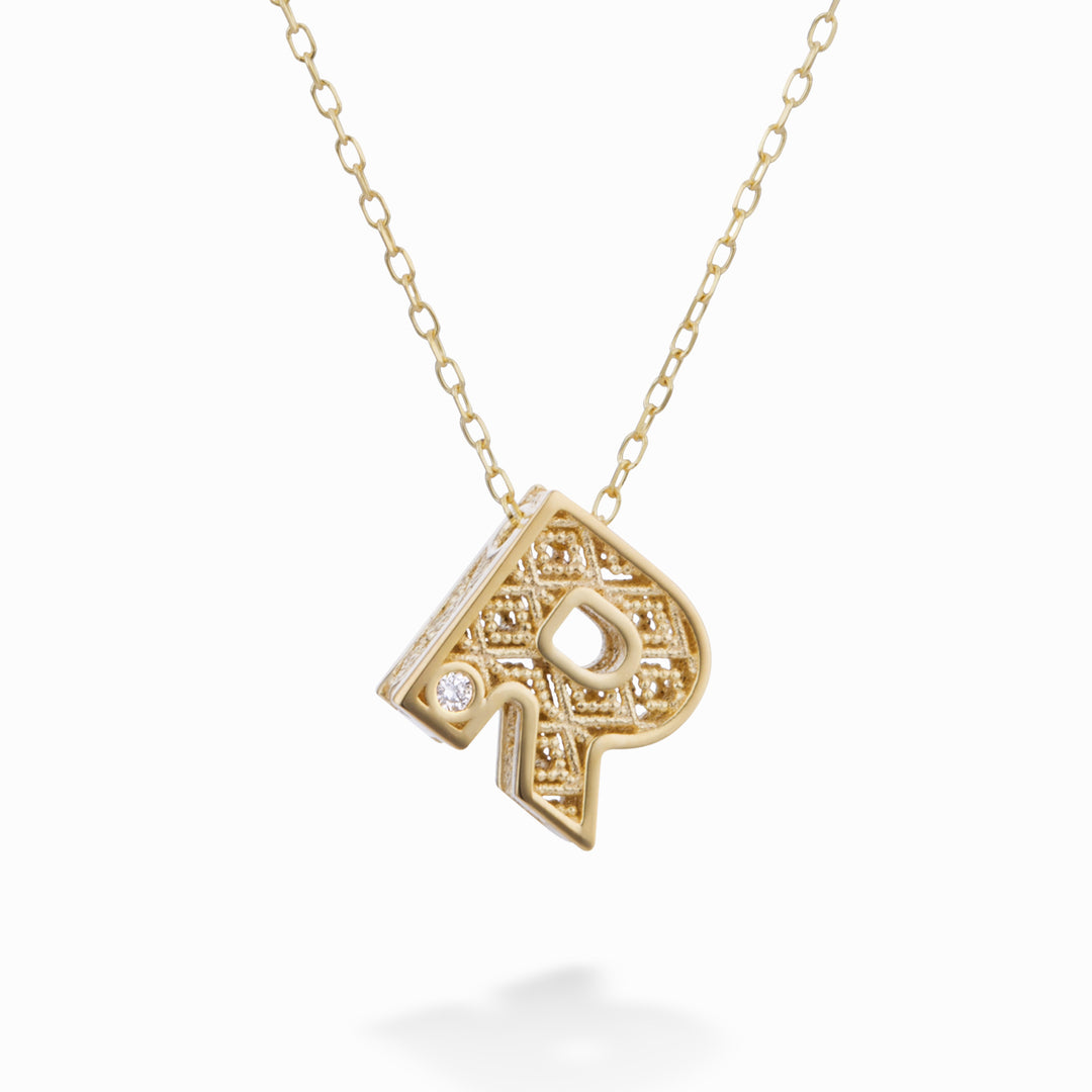 Nihama cl 18k 字母 R 黄金直径。 ct.0,01 NDLETRO1