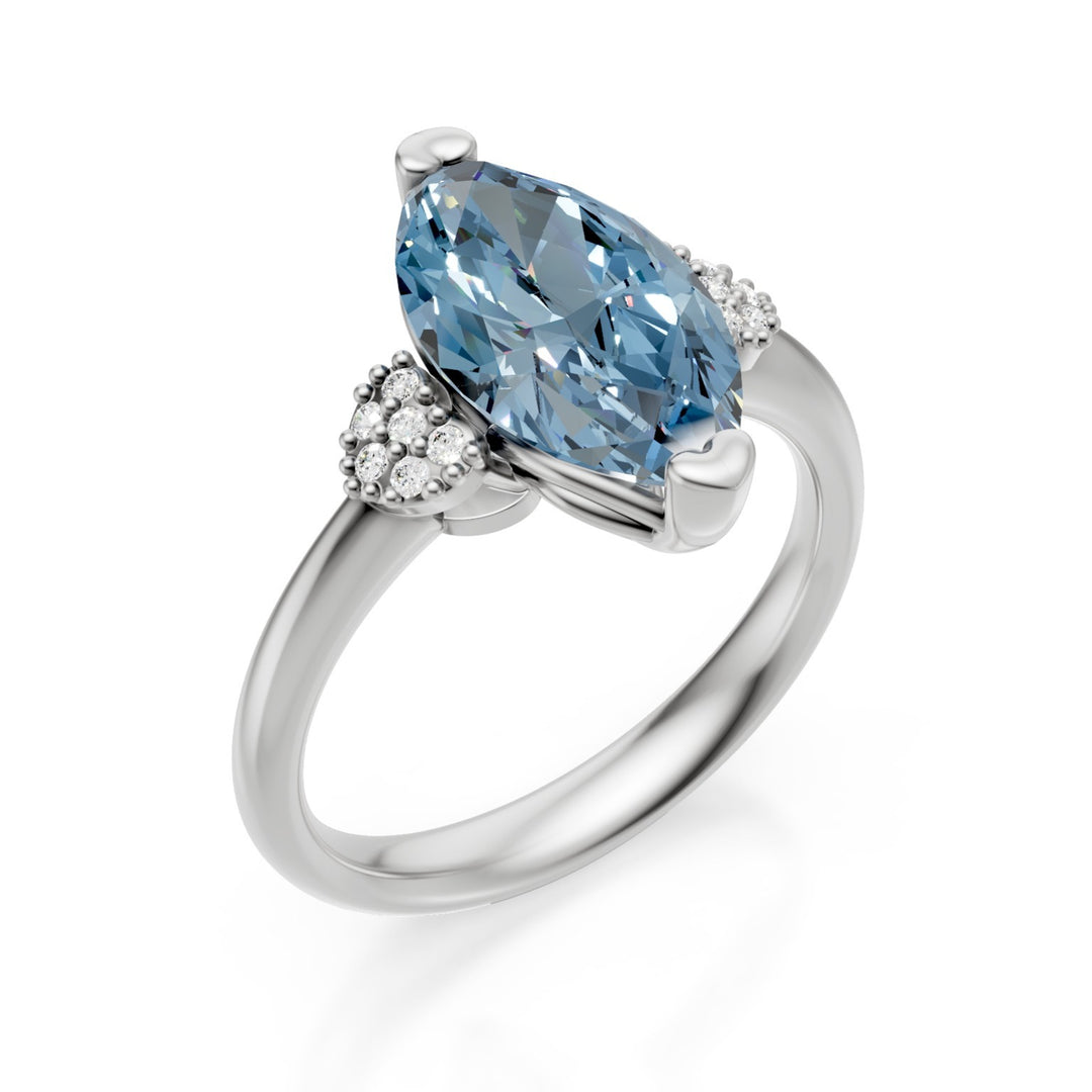 X-Diamond ένα εργαστήριο 18kt g.d. συνολική ct. 2,37 - σεντ. ct. 2,31 μαρκησία φανταχτερό ζωηρό μπλε - πλευρικοί στρογγυλοί που σχηματίζουν δύο καρδιές ct. 0,06 LXDAPU083O4MABL237