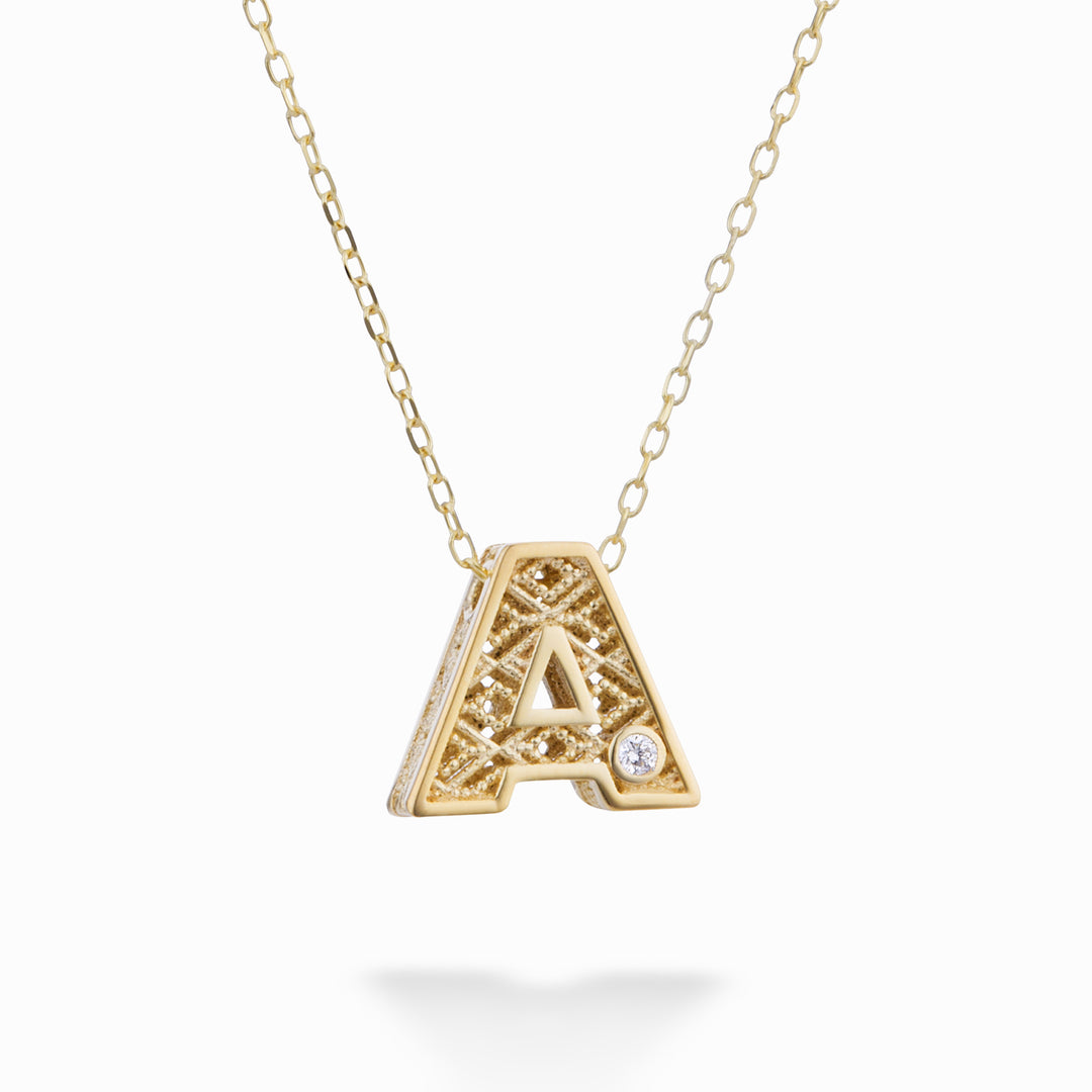 Nihama cl 18k gult guld bokstav diam. ct.0,01 NDLETAO1